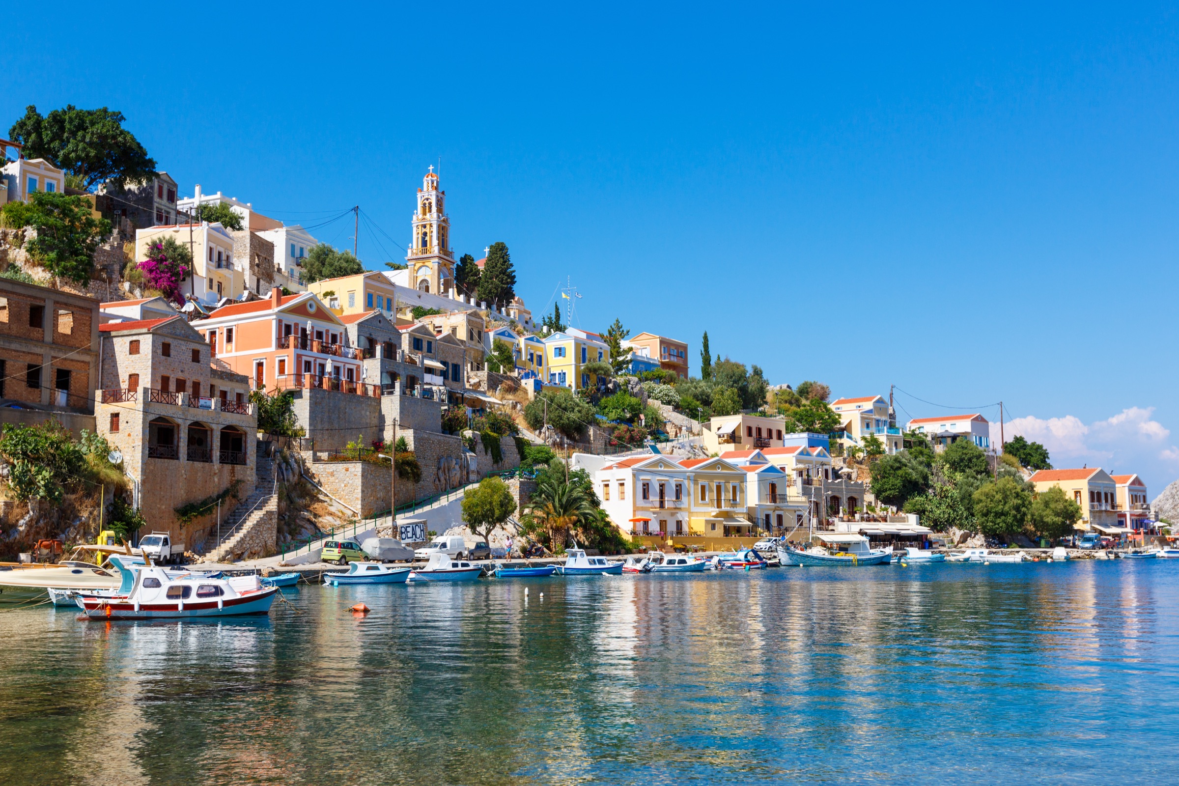 Colourful homes and boats along Symi harbour