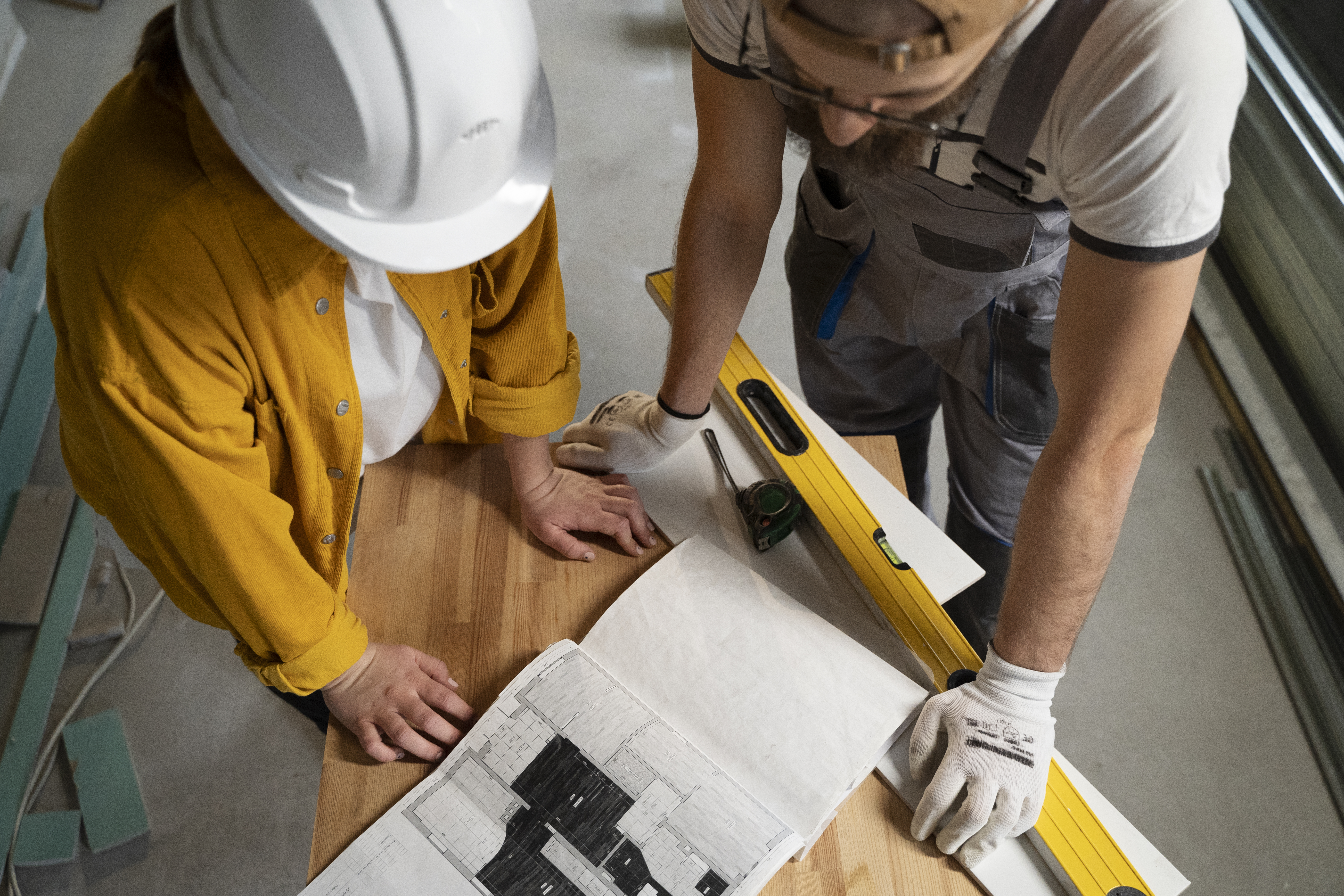 Contractors reviewing renovation plans