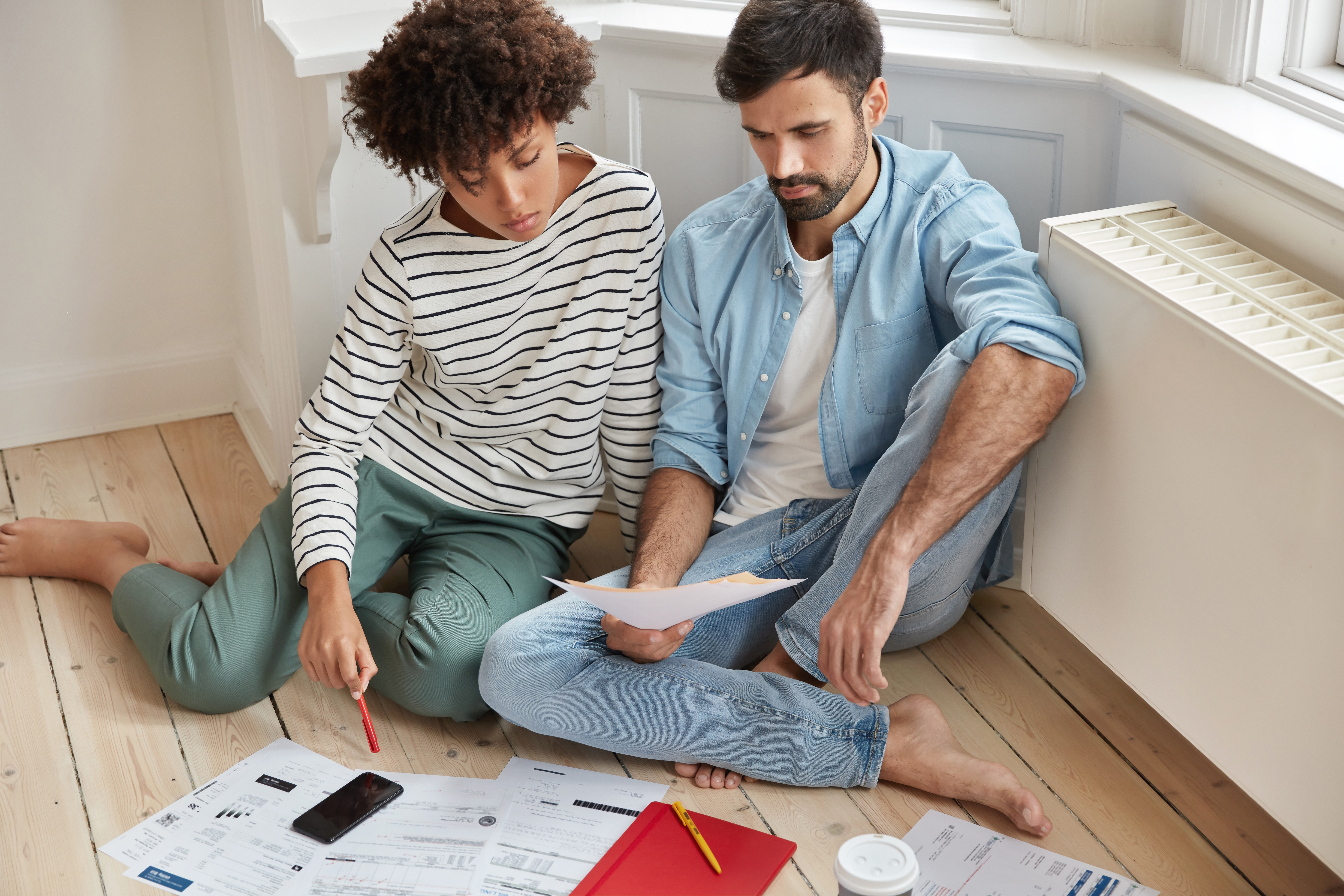 Homeowners reviewing renovation plans